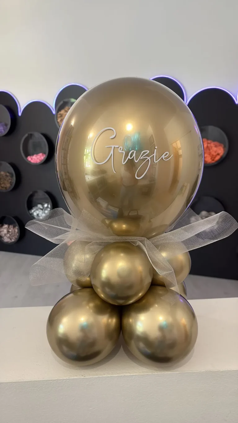 Composizione di palloncini oro con scritta Grazie